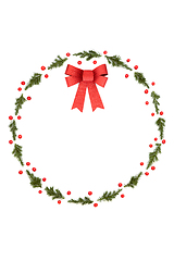 Image showing Christmas Decorative Fir and Holly Berry Winter Wreath with Bow
