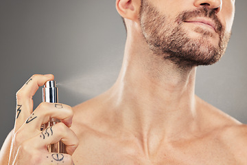 Image showing Man, perfume and hands spray on neck for beauty wellness or luxury fragrance cosmetics in studio. Hygiene grooming, clean and fresh colagne for handsome male skincare and sensual body care lifestyle