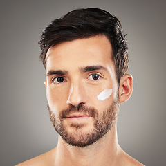 Image showing Cream, man and skincare for natural beauty, wellness and body care with grey studio background. Portrait, cosmetics and healthy male with lotion for hygiene, smooth face and organic facial for health