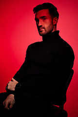 Image showing Red light, fashion model and man with designer clothes, beauty and lifestyle brand. Portrait of a contemporary, creative and edgy clothing with person looking calm, cool and modern with style