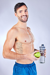 Image showing Water bottle, apple and healthy man in studio portrait for diet, clean body and fitness marketing or advertising. Sports, strong and gym model with muscle wellness, healthy food and fruit nutrition