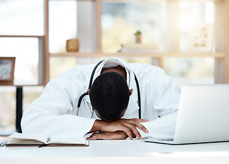 Image showing Doctor, tired and stress in office with anxiety, depression or headache in hospital, workplace or work room. Burnout, sad and mental health medic with laptop for medical, healthcare or clinic job