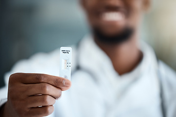 Image showing Covid, hand and antigen rapid test with a black man showing his negative result after a medical exam. Health, wellness and insurance with a male holding up a reading on a corona virus testing kit