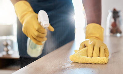 Image showing Black man hands, spray bottle or cleaning cloth for wooden table or desk in house living room, home or office building. Zoom, cleaner or maid service with fabric product for bacteria hygiene wellness