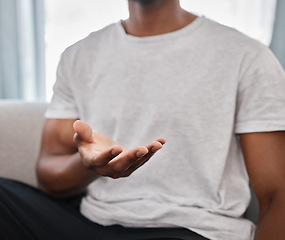 Image showing Marketing, product placement and hands of a man advertising with palm on the sofa in a house lounge. Branding, logo and hand of a person to show a product in space while on the living room couch