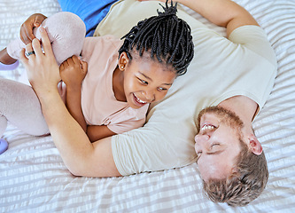 Image showing Adoption, play and father with girl on the bed in the morning with a smile for happy in their family home. Family, love and dad playing with his child in a bedroom, love and laugh in a house together