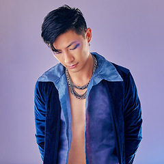 Image showing Asian man, fashion and cyberpunk makeup aesthetic for futuristic beauty or vintage clothes. Retro, creative pop art gen z model and funky rock style with metal chain in purple background studio