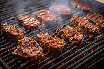 Image showing Steak sizzling on a grill