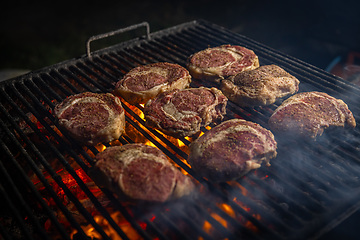 Image showing Beef steaks on grill