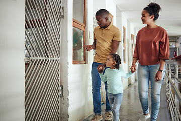 Image showing Black family, animal shelter and planning adoption with mother, father and child walking together inside vet building for charity or volunteer work. Man, woman and girl together at pet ngo center