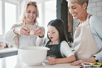 Image showing .Family, baking and bonding for development and learning for culinary skills in the family home. Mother, grandmother and daughter cook or cooking in house with eggs for food for hunger or snack.