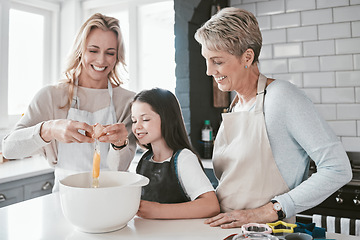 Image showing Mom, grandmother and kid baking together in kitchen, family home and house of fun, learning or development. Happy family generation, girl and child crack eggs for dessert, cookies and teaching recipe