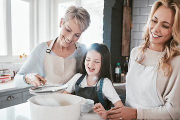 Image showing .Family, grandmother and child cooking together in kitchen for learning, fun or quality time bonding. Generations, grandma teaching kid and mother support happy kid chef for love in family home.