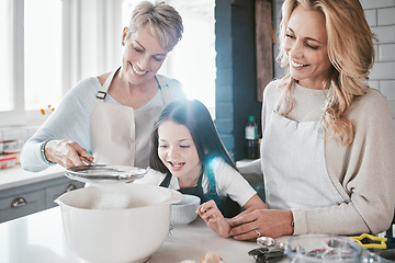 Image showing .Family, children and baking with a grandmother, mother and daughter in the kitchen together for learning. Food, cooking and kids with a woman, parent and girl bonding in the house to bake a pastry.