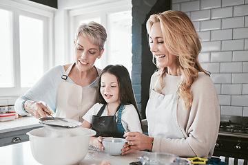 Image showing Family, baking and cooking together in a home kitchen with mother, grandmother and child learning about food and being a chef of baker. Woman, senior and girl helping with flour for pancakes or cake