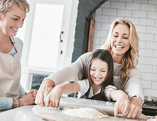 Image showing .Mother, grandmother and child cooking and baking with rolling pin for pastry, pie or pizza together in family kitchen. Woman, senior and girl helping and learning about food, being a chef or baker.