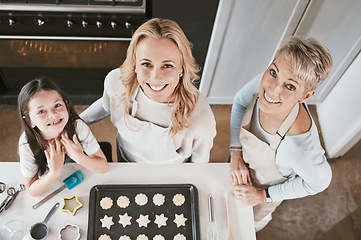 Image showing .Family, cooking and cookies portrait top view with happy smile together helping in home kitchen. Learning, grandma and mother with child busy with food help, preparation and baking for oven.