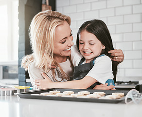 Image showing Family, children and baking with a mother and daughter learning about cooking in the kitchen of their home together. Love, kids and bake with a girl and woman teaching her child about food in a house