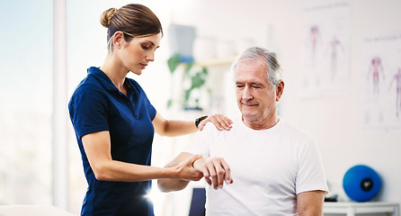 Image showing Nurse, patient and physical therapy for elderly care, medical or healthcare support at the clinic. Woman physiotherapist or chiropractor helping mature man in physiotherapy or arm stretching