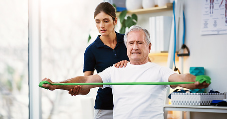Image showing Physiotherapy, senior man and doctor exercise, resistance band and workout for muscle rehabilitation in a clinic. Physiotherapist, elderly patient and training, stretching muscles and body fitness