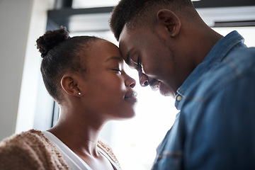 Image showing Black couple, relax and forehead for love, care or relationship bonding together at home. African American man and woman touching heads in loving embrace for caring moment, trust or support indoors