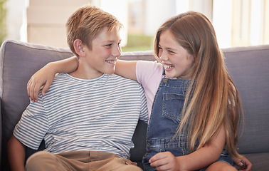 Image showing Love, family and sister with brother on a sofa, laughing and relax while having fun in their home together. Happy, siblings and girl with boy on a couch, enjoy bonding moment in living room in Russia