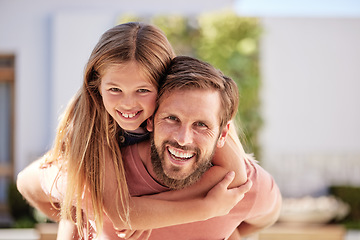 Image showing Portrait father piggy back girl in garden for fun, bonding and quality time with love, care and happiness together. Happy, excited and young kid relax with smile dad in backyard, outdoors and freedom