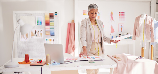 Image showing Planning, fashion and design with business woman in workshop studio for creative, tailor and review. Retail, boutique and shop with senior employee in clothing factory for fabric, graphic and textile