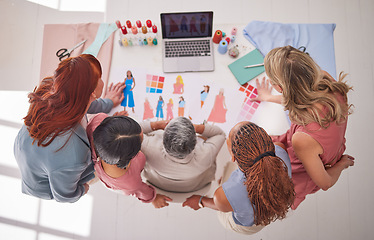 Image showing Creative business people, fashion and design above in meeting for planning, collaboration or decision at the office. Group of employee designers in team strategy, brainstorming or discussion on table