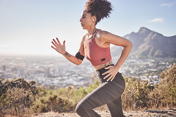 Image showing Music, fitness and woman running along mountain, listening to radio while doing morning cardio, wellness and exercise. Sports, podcast and black woman focused on training, run and workout with energy