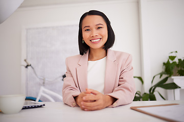 Image showing Business woman, asian and boss or ceo of a company at office desk with a smile and pride for career choice and achievement. Portrait of a female entrepreneur and leader happy about startup success
