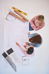 Image showing Top view, teamwork and architects with blueprint in office for construction project from above. Meeting, architecture and development planning of contractors or engineers with building design sketch.