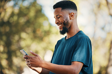 Image showing Black man with smartphone, communication outdoor with technology, message or email with 5g network in nature. Online, social media and internet connection, check cellphone and smile at meme or text.