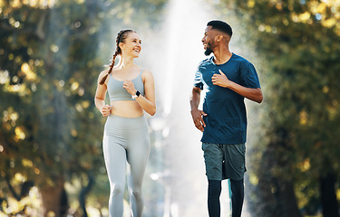 Image showing Diversity, running and couple wellness conversation in park for training exercise and sports marathon motivation. Interracial runner athletes, cardio workout and healthy fitness together in forest