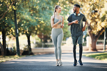 Image showing Running, fitness and interracial couple in nature for cardio, exercise and marathon training. Workout, sports and young man and woman with motivation, love and health as a runner in park with energy