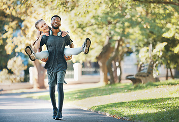 Image showing Interracial couple, piggy back and outdoor with smile for fitness, health and exercise in park. Runner, black man and woman on back in workout, running or wellness in urban sunshine by trees together