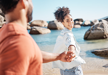 Image showing Black couple, holding hands and beach vacation with wife leading partner to follow into water for adventure, fun and travel. Man and woman on summer, holiday by sea for love, support and quality time