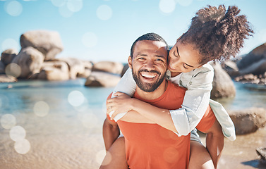 Image showing Black couple, love and beach for travel, vacation and adventure in nature with a piggy back game for fun together in nature. Man and woman together on holiday by the sea in summer for quality time