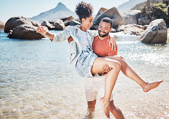 Image showing Couple, beach and man carrying woman for love, marriage support and funny holiday vacation. Travel, quality time together and summer freedom in Hawaii, sunshine and relax on ocean sand for happiness