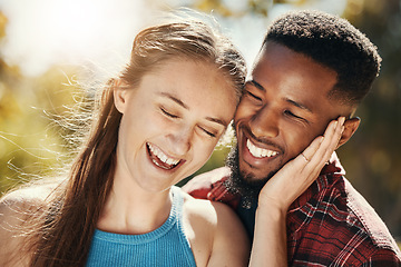 Image showing Diverse, couple and love, care and affection with a couple enjoying a happy vacation or getaway in nature. Loving, caring and affection affectionate man and woman being close and embracing on holiday