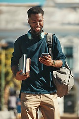 Image showing Student, education and phone with a black man university pupil walking on campus while typing a text message. Social media, communication and contact with a male at college reading on his smartphone