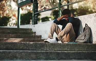 Image showing Mental health, depression and anxiety with student on stairs with backpack for failure, fear and mistake. Sad, stress or bullying with black man on steps of college campus for frustrated or problem