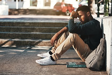 Image showing Education, fail and stress with a black man student worried about an exam or test on university campus. College, sad and scholarship with a male pupil feeling depressed after a negative report