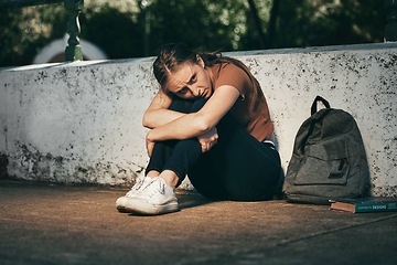 Image showing Woman, student and depression in lonely stress, anxiety or mental health problems in the outdoors. Sad and depressed female teenager in distress, loneliness or trouble at school or university