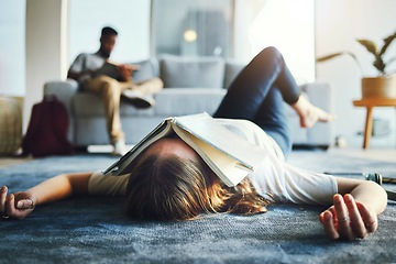 Image showing Burnout, student and tired woman with book on her face for knowledge exhaustion and fatigue. College, university and problem with a female lying on the floor covered in a notebook for studying