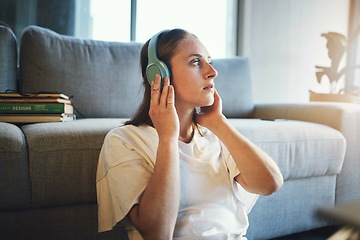 Image showing Woman relax, music headphones and peace on living room sofa, sound and freedom, calm lifestyle or mindfulness. Young girl listening to meditation audio, web radio or streaming sound in apartment home