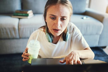 Image showing Laptop, student and confused woman in home working online, studying and busy with project. Education, college and stressed girl with smoothie in living room doing work, research and task on computer