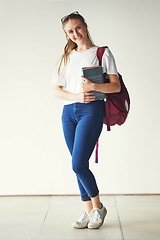 Image showing Portrait, education and happy student, textbook and bag ready for college, school or university on campus. Young woman, scholarship and smile for study learning and books with vision, goals or target