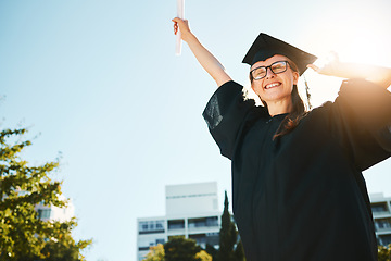 Image showing Woman, student and graduate for university achievement, scholarship or success for grades at the campus. Happy female in celebration for graduation, certificate or diploma for academic qualifications