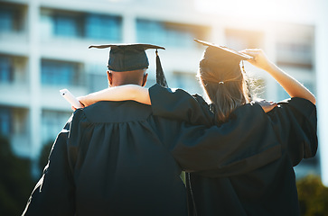 Image showing Graduation, city and students celebrating academic achievement ceremony in urban background. Education, celebration and graduate student friends embrace or hug for educational success